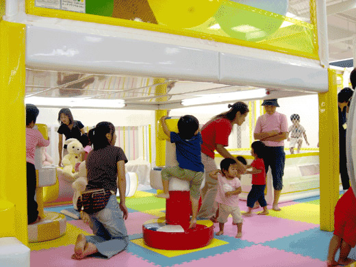 Children playing with Spinning Daruma